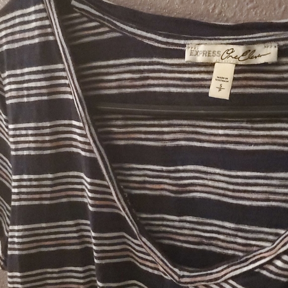 A striped shirt with tie in front - Picture 2 of 3